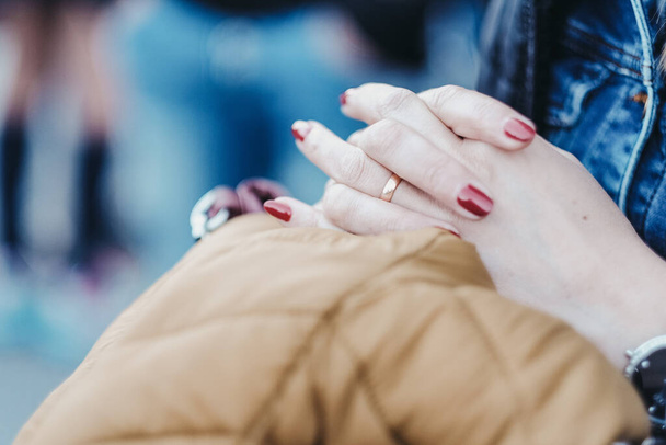 A closeup shot of female hands with red nail polish - Valokuva, kuva