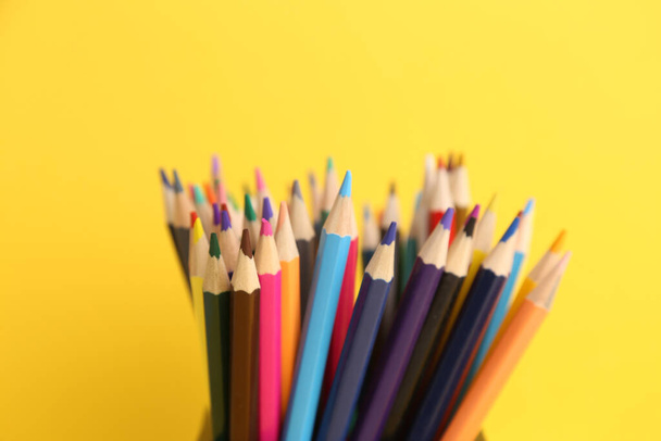 A closeup shot of colored wooden pencils to draw - Fotó, kép