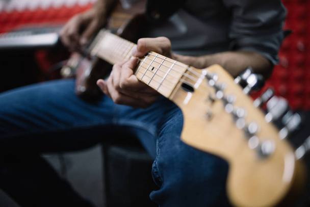 Close-up view of mans hands playing electric guitar - Φωτογραφία, εικόνα