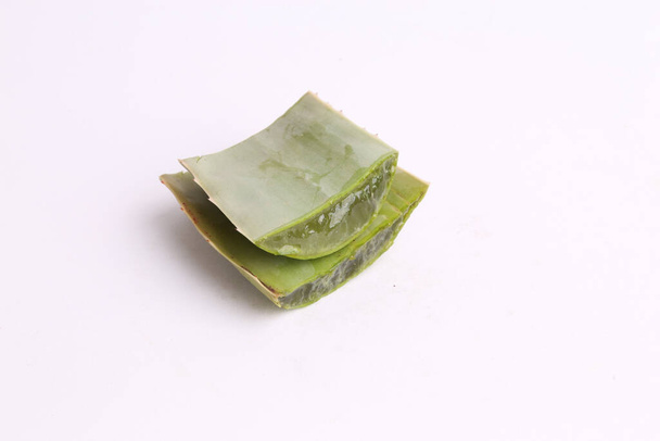 A closeup shot of a cut aloe vera isolated on a white background - 写真・画像