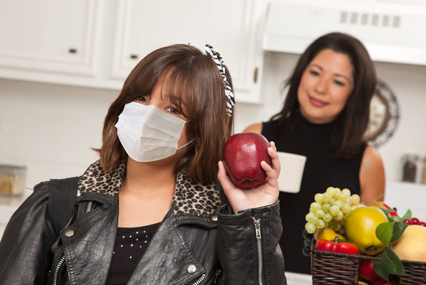 Young Hispanic Girl Student with Mother At Home Getting Ready For School Wearing Medical Face Mask. - Photo, Image