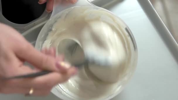 hands mixing hair dye bowl light hair dye mixture - Footage, Video