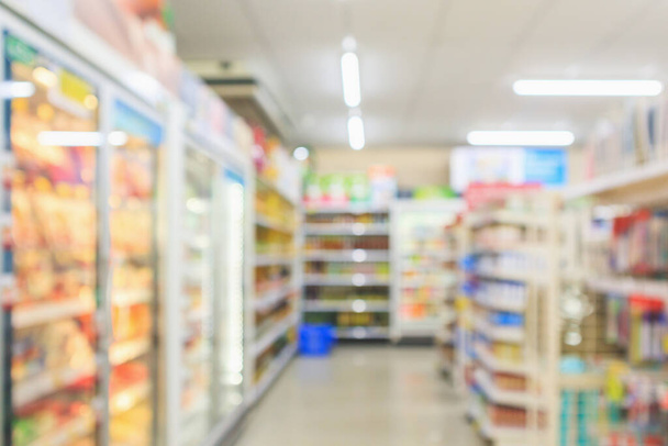Supermarket aisle interior shelves blur background - Foto, Imagen