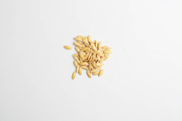 A high angle shot of an isolated heap of melon seeds - Photo, image