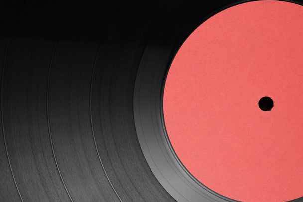 12-inch LP vinyl record disk with blank red label. Close-up shot, top view - Фото, зображення