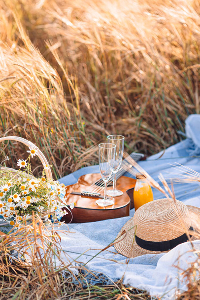 Closeup of picnic on nature in wheat field. - 写真・画像