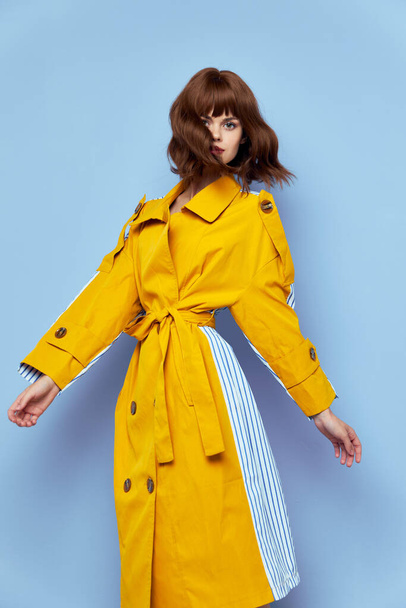  woman Yellow coat with buttons model brunette portrait  - Valokuva, kuva