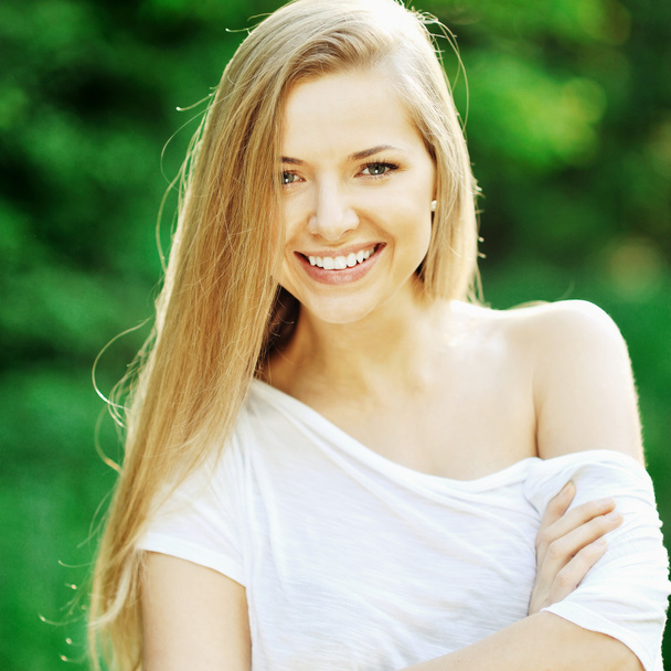 Portrait of beautiful female model outdoors - Photo, Image