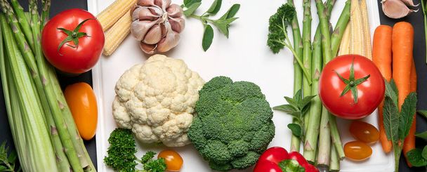 Fresh vegetables  on white cutting borad. Top view, flat lay. Panorama, banner - Zdjęcie, obraz