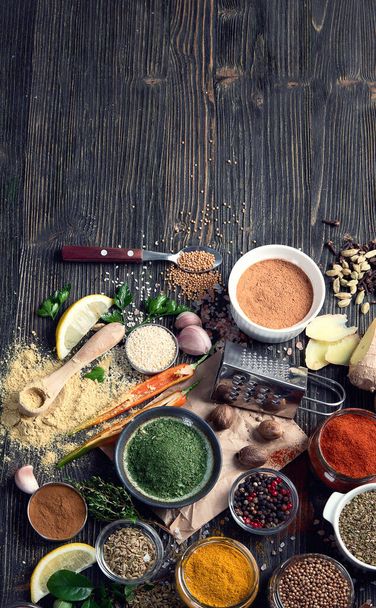 Various  spices for cooking on rustic wooden background. Top view with copy space - 写真・画像
