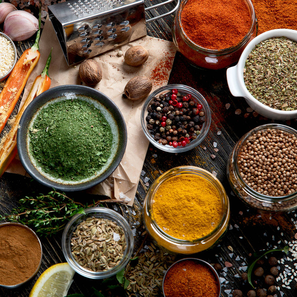Various  spices for cooking on rustic wooden background. Top view  - 写真・画像
