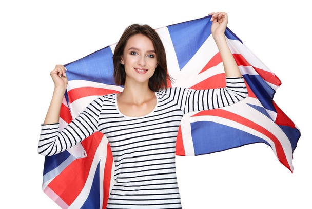 Beautiful young woman holding british flag on white background - Fotoğraf, Görsel