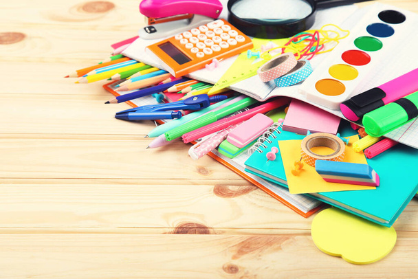 School supplies on brown wooden table - Photo, Image