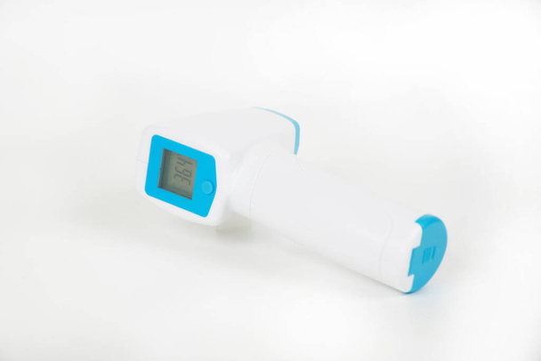 close-up view of infrared thermometer isolated on white background - 写真・画像