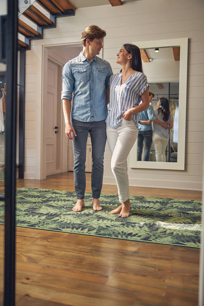 Lovely family portrait of two happy people wearing casual clothes in home - Photo, Image