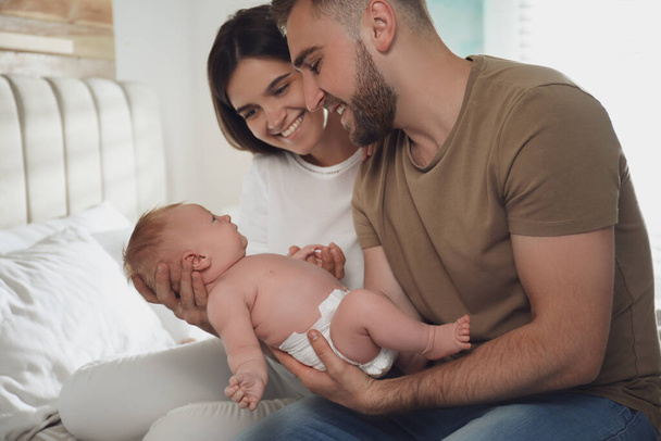 Happy couple with their newborn baby at home - Foto, immagini