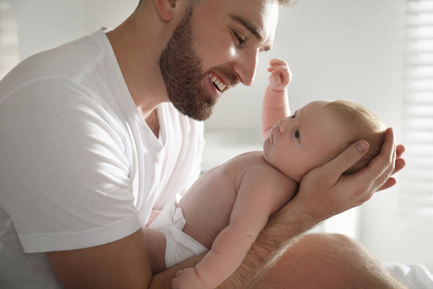 Father with his newborn son at home, closeup - Foto, Imagem