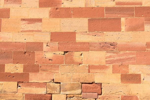 Un vecchio muro di mattoni, vecchia texture di blocchi di pietra rossa primo piano - Foto, immagini