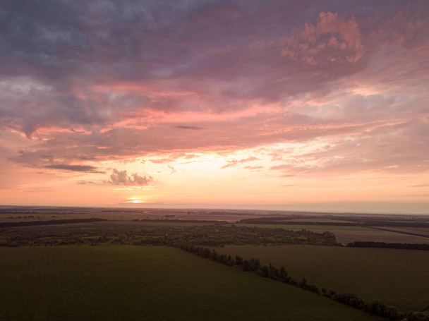 Aerial view. Sunset over Ukrainian agricultural fields. - Photo, Image