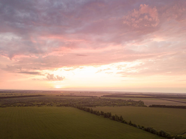 Aerial view. Sunset over Ukrainian agricultural fields. - Photo, Image