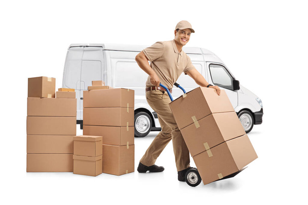 White delivery van and a male worker loading boxes isolated on white background - Fotoğraf, Görsel