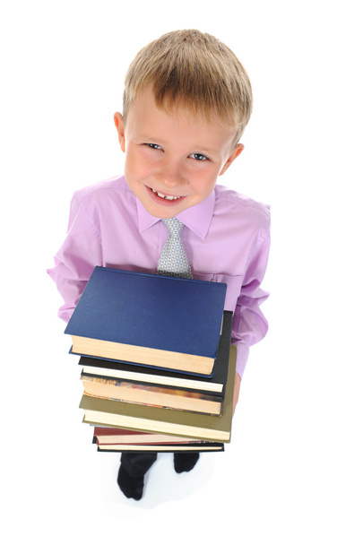 Boy holds a stack of books - Фото, изображение