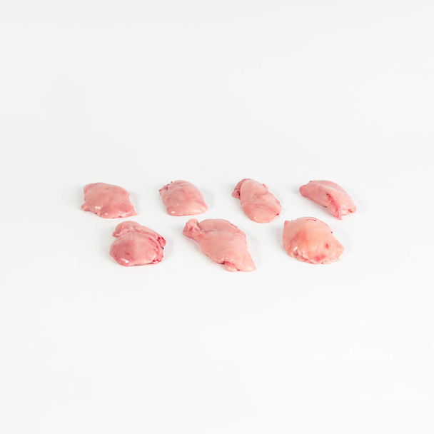 seven pieces of sweetbreads of suckling lamb , photograph taken on pure white background, for e-commerce. front view - Photo, Image
