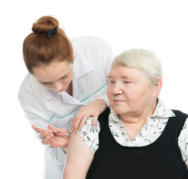 Doctor making senior woman patient an arm subcutaneous insulin - Foto, Imagen