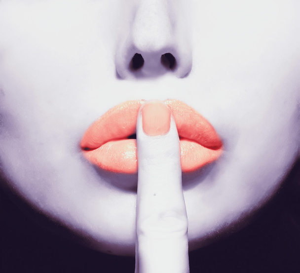 Part of face with finger on lips - Foto, Imagen