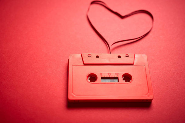 old red cassette tape on a minimalist background - 写真・画像