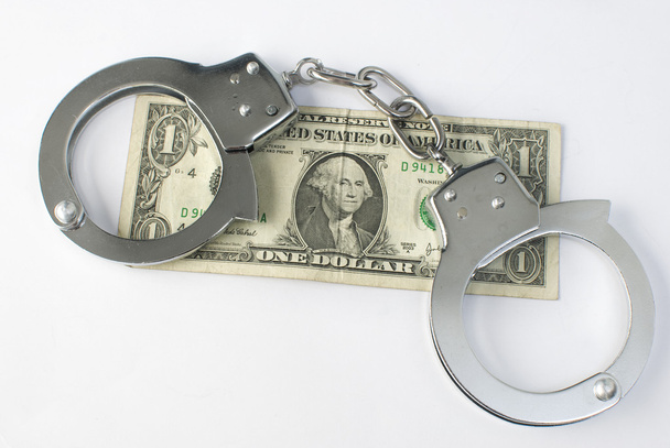 Close-up handcuffs and money - 写真・画像