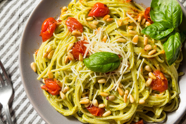 Healthy Homemade Basil Pesto Pasta with Tomatoes and Pine Nuts - Fotó, kép