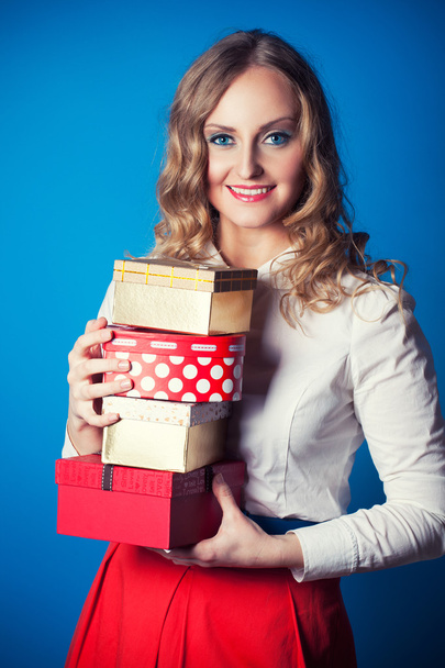 Woman with a gift boxes - Фото, изображение