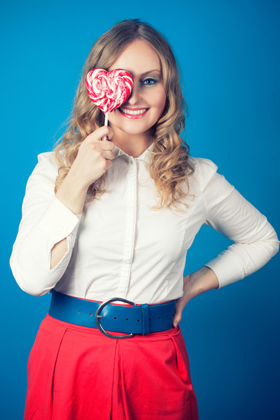 Beautiful young woman with lollipop - Foto, Imagen