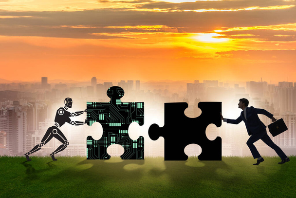 Robot and human cooperating in jigsaw puzzle - Photo, Image