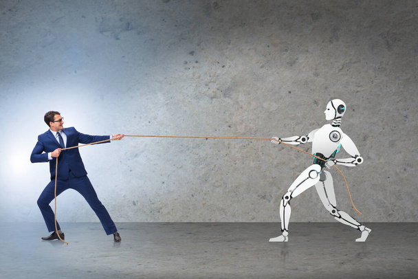 Ανταγωνισμός μεταξύ ανθρώπων και ρομπότ στην έννοια της διελκυστίνδας - Φωτογραφία, εικόνα