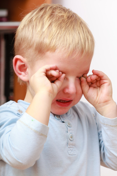 Childhood. Portrait of unhappy crying boy child kid at home. - Фото, зображення