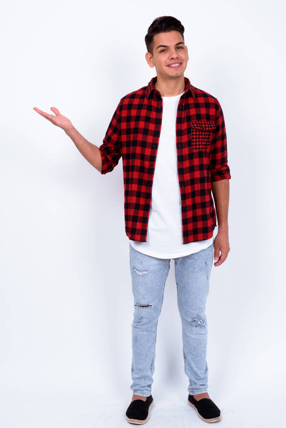 Studio shot of young handsome multi ethnic hipster man against white background - Foto, immagini