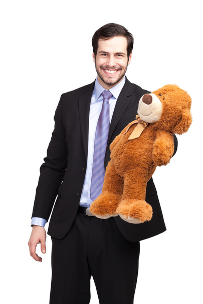 Smiling businessman with teddy bear - Foto, imagen