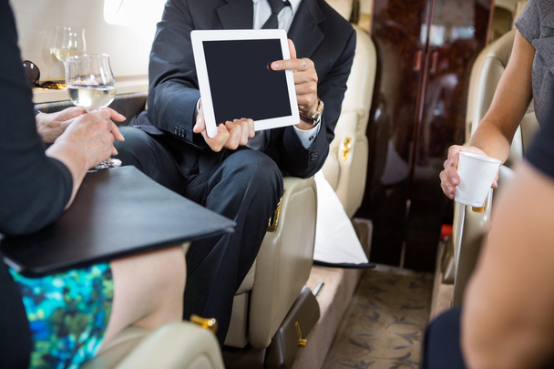Business Partners Working In Private Jet - Photo, Image