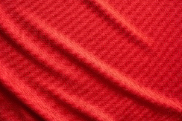 Červené sportovní oblečení tkaniny fotbal dres textury zblízka - Fotografie, Obrázek