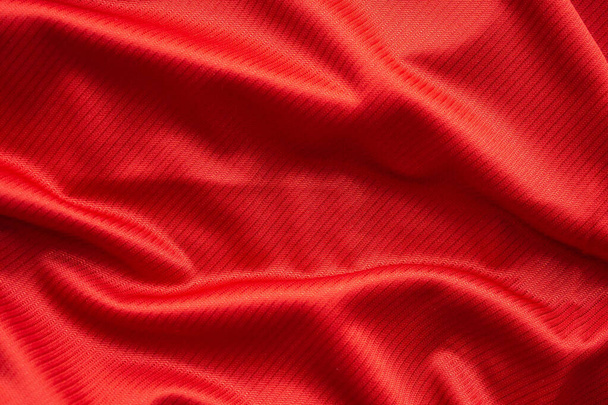 Red sports clothing fabric football jersey texture close up - Photo, Image
