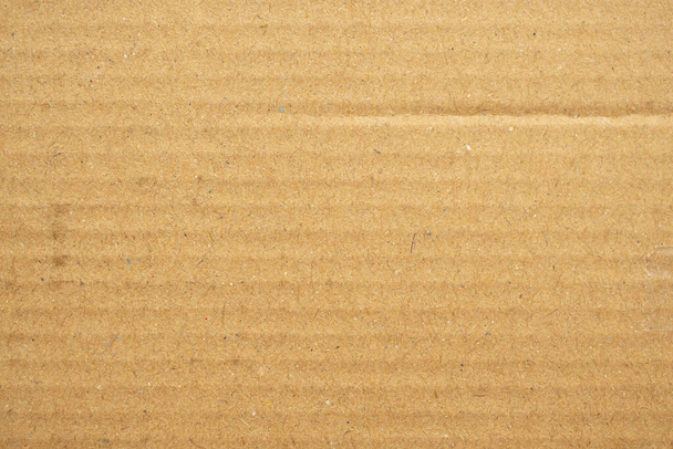 Абстрактный коричневый переработанный картонный фон - Фото, изображение