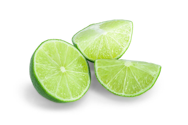 Fresh ripe wedge of green lime citrus fruit isolated on white background,with clipping path. - Photo, Image