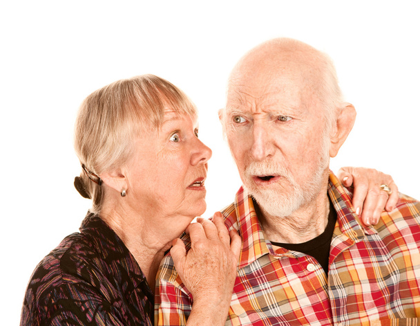 Senior woman sharing information with skeptical man - Foto, imagen
