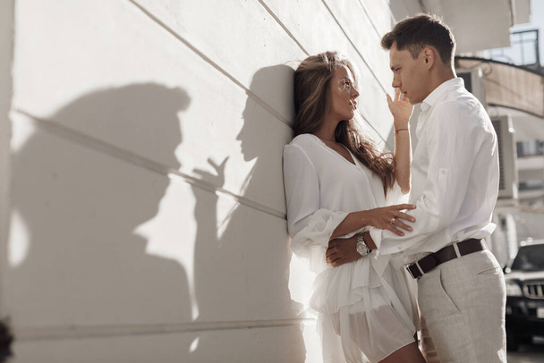 lifestyle engagement photo session young man and woman near yachts, couple in the city - Fotoğraf, Görsel