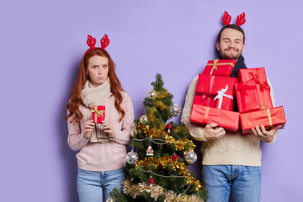 Pretty couple with stack of gifts - Foto, Imagem