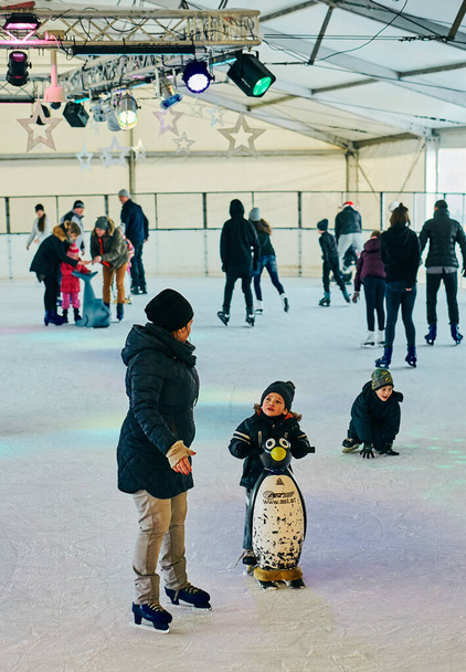 POZNAN, POLAND - Dec 26, 2017: People skating on a ice on a cold winter day - Fotoğraf, Görsel