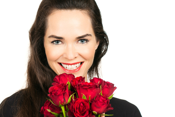 Woman smelling bunch of roses - Foto, Imagen