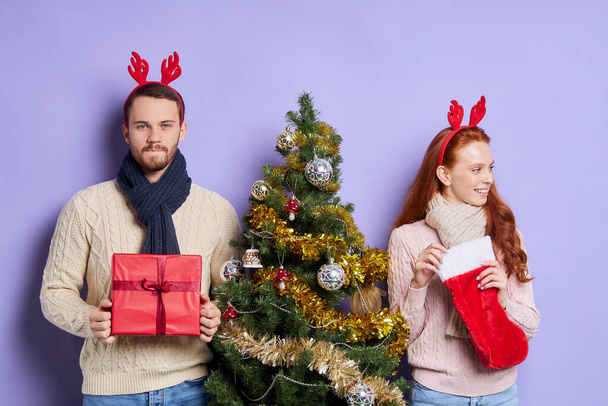 Sweet cute couple with Christmas stocking - Valokuva, kuva
